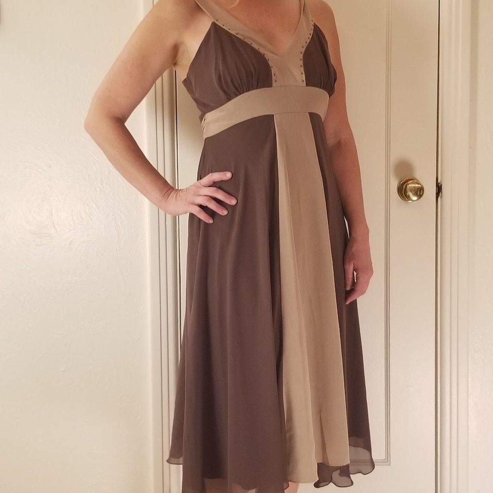 Classic Flowy Dress with bow tie back and metal embellishment on Neckline